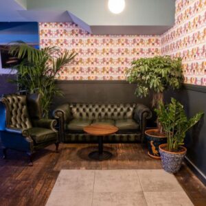 Cosy corner in a restaurant / pub with a sofa and chair