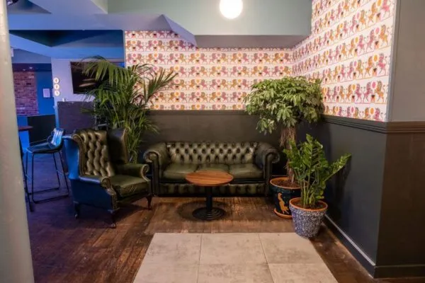 Cosy corner in a restaurant / pub with a sofa and chair
